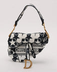 Pre-Loved Saddle Shoulder Bag Star Canvas Medium with Aged Gold Hardware, Navy and White