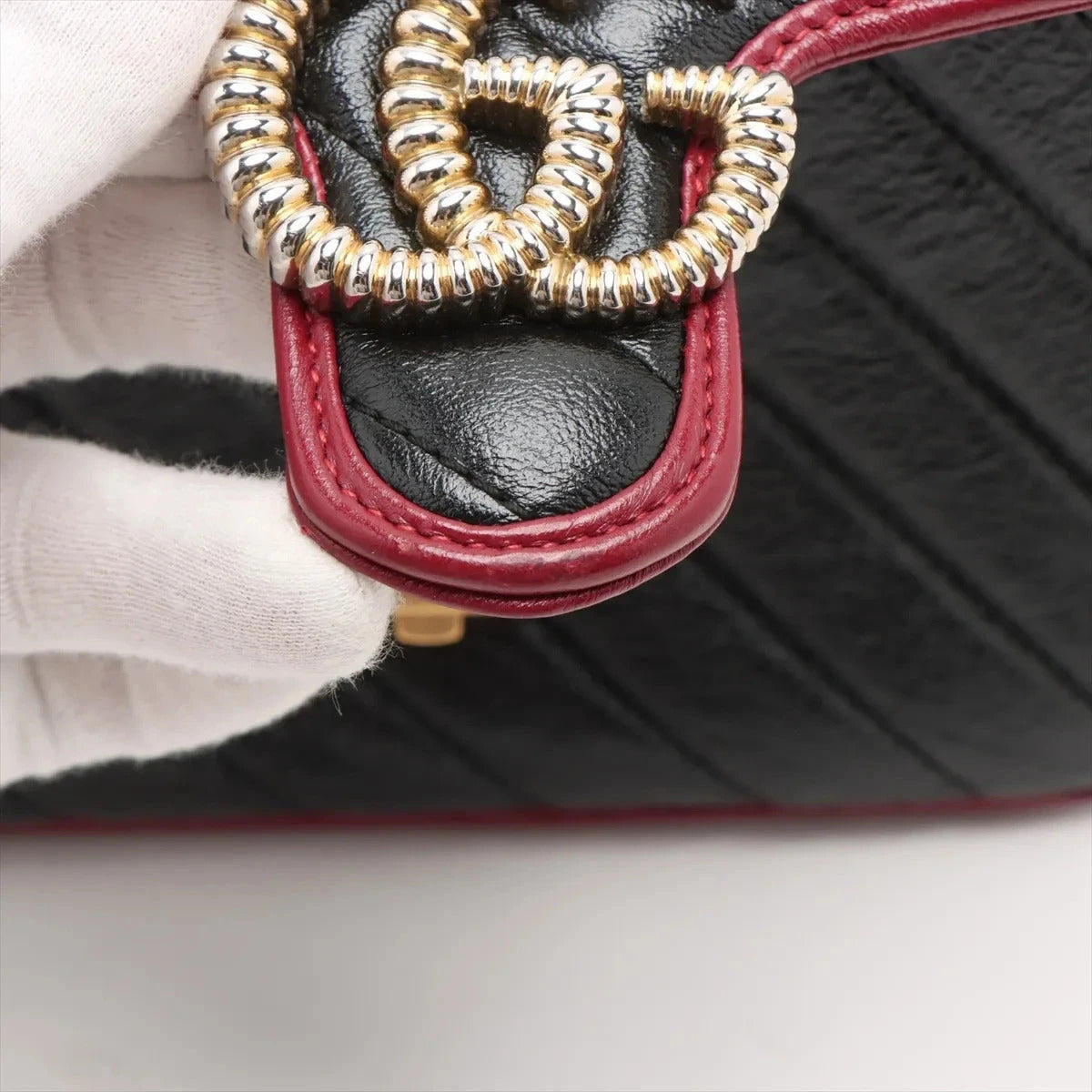 Pre-Loved GG Marmont Top Handle Handbag Quilted Leather Mini with Gold Hardware, Black