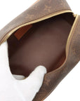 Pre-Loved Dopp Kit Pochette Monogram Coated Canvas with Gold Hardware, Brown